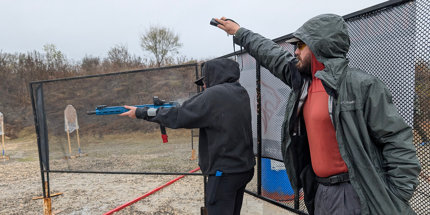 Range officer running a competitor